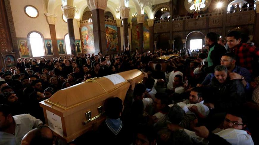 Relatives mourn the victims of the Palm Sunday bombings during the funeral at the Monastery of Saint Mina "Deir Mar Mina" in Alexandria, Egypt April 10, 2017. REUTERS/Amr Abdallah Dalsh - RTX34XXC