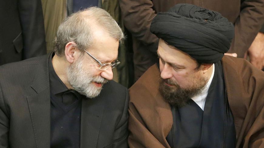 Iranian Parliament speaker Ali Larijani (L) speaks with Hassan Khomeini, grandson of Iran's late founder of the Islamic Republic, during a mourning ceremony for the former Iranian president Akbar Hashemi Rafsanjani at the Jamaran mosque in Tehran on January 9, 2017.
Rafsanjani died in hospital on January 8 after suffering a heart attack. Rafsanjani, who was 82, was a pivotal figure in the foundation of the Islamic republic in 1979, and served as president from 1989 to 1997. / AFP / ATTA KENARE        (Photo