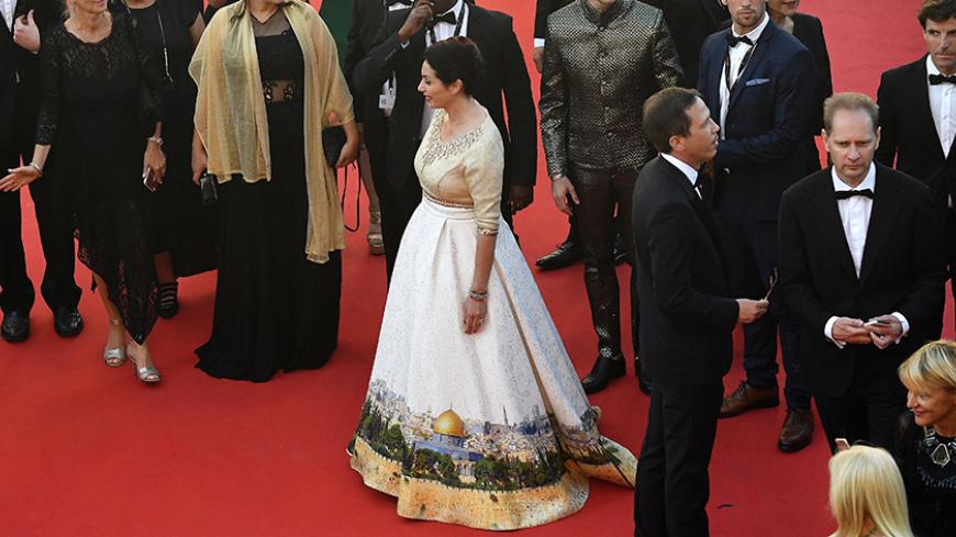 Israeli Culture Minister Miri Regev wearing a dress featuring the old city of Jerusalem arrives on May 17, 2017 for the screening of the film 'Ismael's Ghosts' (Les Fantomes d'Ismael) during the opening ceremony of the 70th edition of the Cannes Film Festival in Cannes, southern France. / AFP PHOTO / Antonin THUILLIER        (Photo credit should read ANTONIN THUILLIER/AFP/Getty Images)