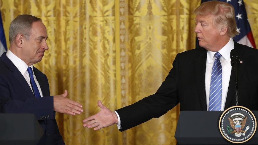 WASHINGTON, DC - FEBRUARY 15:  U.S. President Donald Trump (R) and Israel Prime Minister Benjamin Netanyahu (L) shake hands following a joint news conference at the East Room of the White House February 15, 2017 in Washington, DC. President Trump hosted Prime Minister Netanyahu for talks for the first time since Trump took office on January 20.  (Photo by Win McNamee/Getty Images)