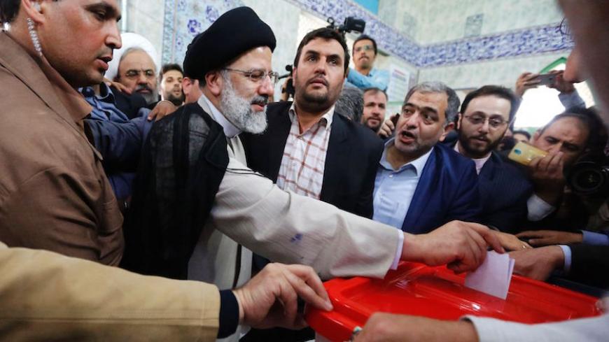Iranian presidential candidate Ebrahim Raisi casts his ballot for the presidential elections at a polling station in southern Tehran on May 19, 2017. / AFP PHOTO / ATTA KENARE        (Photo credit should read ATTA KENARE/AFP/Getty Images)