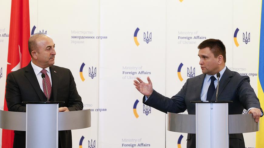 Ukraine's Foreign Minister Pavlo Klimkin (R) and his Turkish counterpart Mevlut Cavusoglu attend a news conference in Kiev, Ukraine, February 10, 2017. REUTERS/Valentyn Ogirenko - RTX30F7R