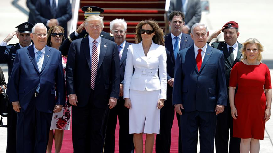 U.S. President Donald Trump (2nd L) and first lady Melania Trump (3rd L) stand with Israeli Prime Minister Benjamin Netanyahu (2nd R), his wife Sara (R) and Israel's President Reuven Rivlin (L) upon their arrival at Ben Gurion International Airport in Lod near Tel Aviv, Israel May 22, 2017. REUTERS/Amir Cohen - RTX36ZTW