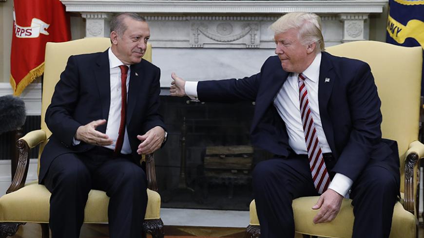 Turkey's President Recep Tayyip Erdogan (L) meets with U.S President Donald Trump in the Oval Office of the White House in Washington, U.S. May 16, 2017. REUTERS/Kevin Lamarque - RTX363HP