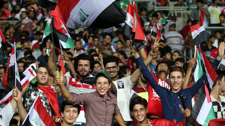 Supporters of the Iraqi national team wave their national flag during the international friendly football match between Iraq and Jordan at Basra Sports City in Basra on June 1, 2017.  / AFP PHOTO / HAIDAR MOHAMMED ALI        (Photo credit should read HAIDAR MOHAMMED ALI/AFP/Getty Images)