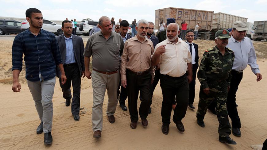 Hamas chief in Gaza Yehya Al-Sinwar (C) visits the border with Egypt, in Rafah in southern Gaza Strip July 6, 2017. REUTERS/Ibraheem Abu Mustafa - RTX3AA6T