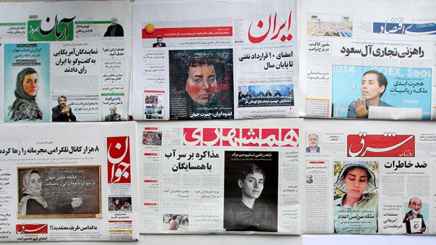 A picture taken in the capital Tehran on July 16, 2017 shows the front pages of Iranian newspapers bearing portraits of the top female scientist Maryam Mirzakhani, who died of cancer a day earlier. 
Iranian-born mathematician, who became the first woman to win the coveted Fields Medal in 2014, died on July 15 in a US hospital after the breast cancer she had been battling for four years spread to her bone marrow, at the age of 40. / AFP PHOTO / ATTA KENARE        (Photo credit should read ATTA KENARE/AFP/Get