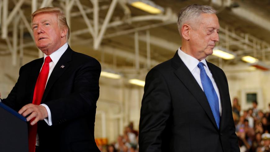 U.S. President Donald Trump (L) is introduced by Defense Secretary James Mattis (R) during the commissioning ceremony of the aircraft carrier USS Gerald R. Ford at Naval Station Norfolk in Norfolk, Virginia, U.S. July 22, 2017. REUTERS/Jonathan Ernst - RTX3CIPV