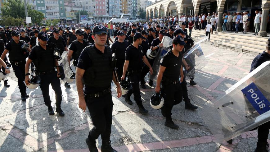 Riot police walk during a pro-Kurdish gathering in the southeastern city of Diyarbakir, Turkey, August 31, 2016. To match TURKEY-SECURITY/POLICE    REUTERS/Sertac Kayar - S1AEUAIGPRAA