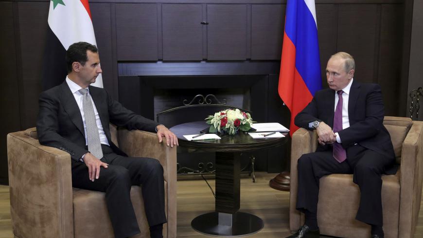 Russian President Vladimir Putin (R) meets with Syrian President Bashar al-Assad in the Black Sea resort of Sochi, Russia November 20, 2017. Picture taken November 20, 2017.  Sputnik/Mikhail Klimentyev/Kremlin via REUTERS  ATTENTION EDITORS - THIS IMAGE WAS PROVIDED BY A THIRD PARTY.     TPX IMAGES OF THE DAY - RC1150583BD0