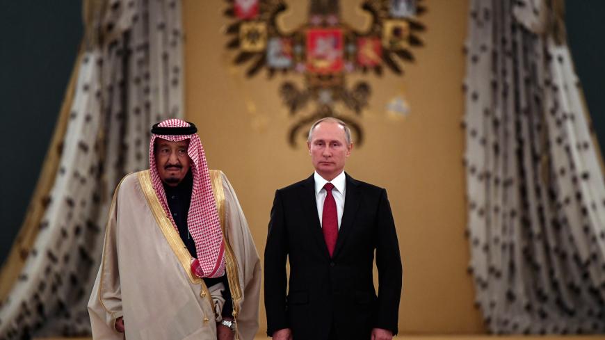 Russian President Vladimir Putin (R) and Saudi Arabia's King Salman attend a welcoming ceremony ahead of their talks in the Kremlin in Moscow, Russia October 5, 2017. REUTERS/Yuri Kadobnov/Pool - RC18A862CF80