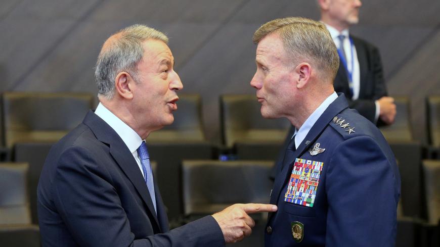 Turkey's Defence Minister Hulusi Akar and Supreme Allied Commander Europe (SACEUR) U.S. Air Force General Tod Wolters attend a NATO Defence Ministers meeting in Brussels, Belgium June 26, 2019. REUTERS/Francois Walschaerts - RC153052BAD0