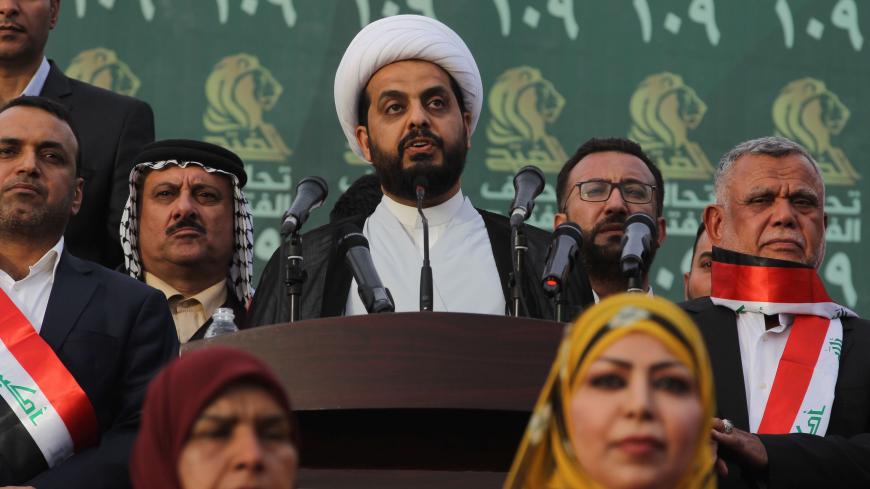 Qais al-Khazaali (C) leader of the Asa'ib Ahl al-Haq, one of the units of the Hashed al-Shaabi (Popular Mobilisation units) gives a speech during a campaign rally for the Fateh Alliance, a coalition of Iranian-supported militia groups, in Baghdad on May 7, 2018, ahead of Iraq's parliamentary elections to be held on May 12. (Photo by AHMAD AL-RUBAYE / AFP)        (Photo credit should read AHMAD AL-RUBAYE/AFP/Getty Images)
