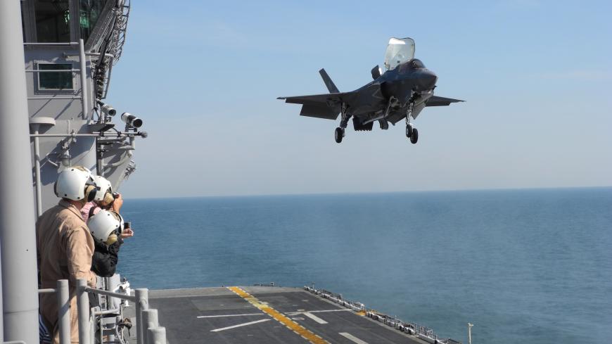 A F-35 fighter jet performs a vertical landing on the USS Wasp during sea trials off the coast of Virginia, October 18, 2011. Critics say the F-35, which comes in three variants, is an ill-conceived multipurpose aircraft that tries to do too many things and will ultimately excel at none. Its stealthy fuselage and high-tech systems, some say, are so complex and difficult to maintain they will inevitably make it unaffordable. But advocates view the aircraft as a war-fighting platform for the networked, iPad g
