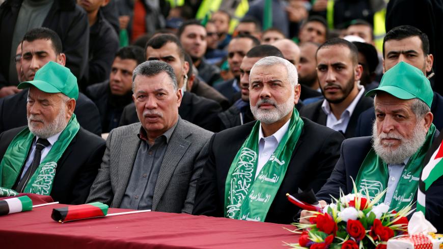 Hamas Chief Ismail Haniyeh (2nd R) attends a rally marking the 30th anniversary of Hamas' founding, in Gaza City December 14, 2017. REUTERS/Mohammed Salem - RC17C6C8A1E0
