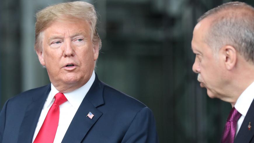 U.S. President Donald Trump talks to Turkeyís President Recep Tayyip Erdogan at NATO headquarters in Brussels, Belgium July 11, 2018. Tatyana Zenkovich/Pool via REUTERS - RC1B9A3C2D00
