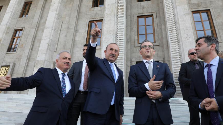German Foreign Minister Heiko Maas is accompanied by his Turkish counterpart Mevlut Cavusoglu as he visits Turkish Parliament in Ankara, Turkey September 5, 2018. Adem Altan/Pool via Reuters - RC1A3DB5E230