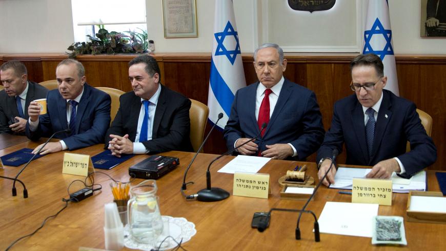 Israeli Prime Minister Benjamin Netanyahu (2nd R) attends the weekly cabinet meeting with Israeli Public Security Minister Gilad Erdan (L), Israeli Minister of National Infrastructure Yuval Steinitz (2nd L), Israeli Minister of Transportation Yisrael Katz (3rd L) and Cabinet Secretary Tzachi Braverman (R) at the Prime Minister's office in Jerusalem September 16, 2018. Sebastian Scheiner/Pool via Reuters *** Local Caption *** - RC17A51E1F20