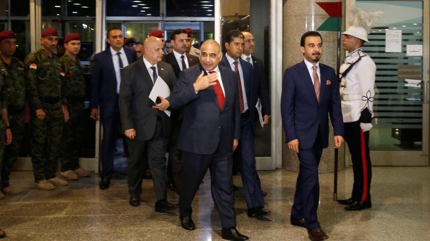 Iraq's Prime Minister-designate Adel Abdul Mahdi and the speaker of Iraq's parliament Mohammed al-Halbousi arrive at the parliament building in Baghdad, Iraq, October 24, 2018. REUTERS/Khalid al Mousily - RC1D24E3EB30
