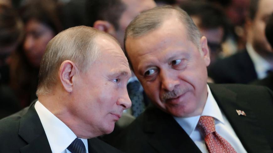 Russian President Vladimir Putin (L) and his Turkish counterpart Tayyip Erdogan speak during a ceremony to mark the completion of the sea part of the TurkStream gas pipeline, in Istanbul, Turkey November 19, 2018. Sputnik/Mikhail Klimentyev/Kremlin via REUTERS  ATTENTION EDITORS - THIS IMAGE WAS PROVIDED BY A THIRD PARTY. - RC12DCA255B0