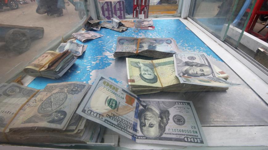 Iranian rials, U.S. dollars and Iraqi dinars are seen at a currency exchange shop in Basra, Iraq November 3, 2018. Picture taken November 3, 2018. REUTERS/Essam al-Sudani - RC1645948610