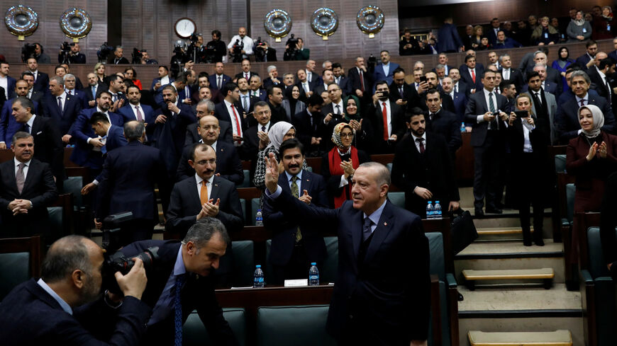 Turkish President Tayyip Erdogan greets members of parliament from his ruling AK Party (AKP) as he arrives at a meeting at the Turkish parliament in Ankara, Turkey, January 8, 2019. REUTERS/Umit Bektas - RC1CE33DB120