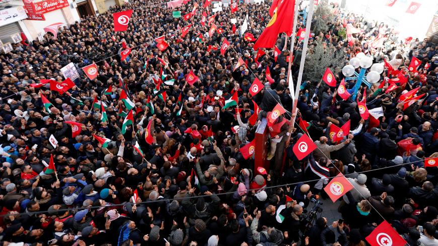 People shout slogans during a nationwide strike against the government's refusal to raise wages in Tunis, Tunisia January 17, 2019. REUTERS/Zoubeir Souissi - RC17459A83B0