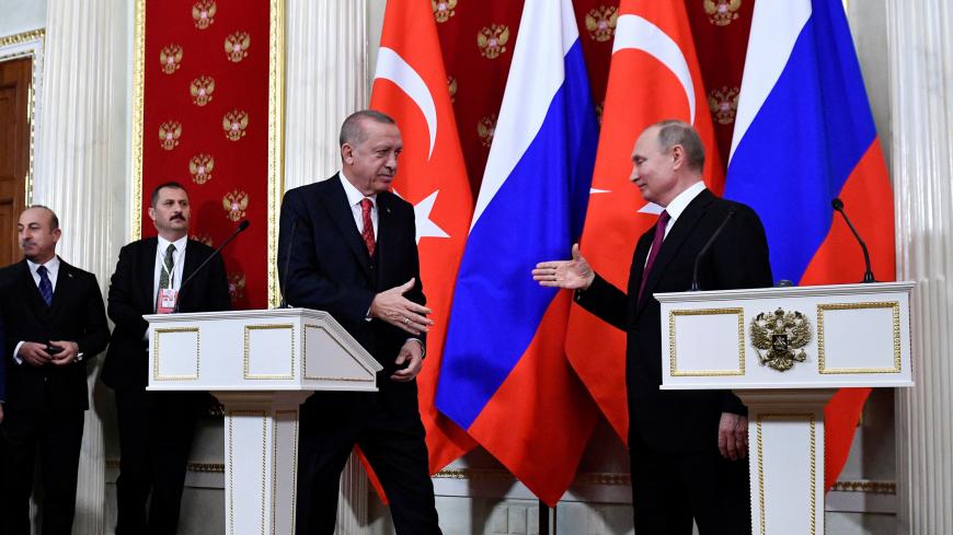 Russian President Vladimir Putin and his Turkish counterpart Recep Tayyip Erdogan shake hands at the end of a joint press conference following their meeting at the Kremlin in Moscow, Russia, January 23, 2019. Aleksander Nemenov/Pool via REUTERS - RC1C245362B0