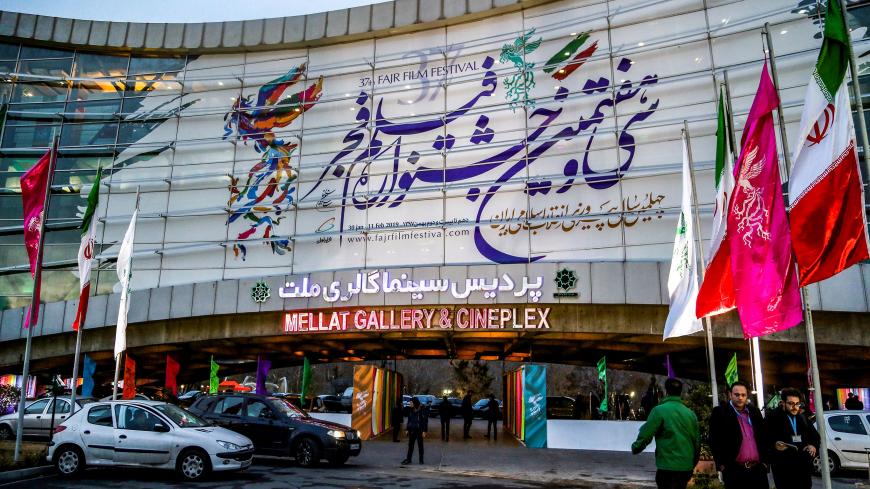 Iranians arrive at the Mellat Cinema Complex in the capital Tehran on February 3, 2019, during the 37th edition of the Fajr Film Festival. (Photo by ATTA KENARE / AFP)        (Photo credit should read ATTA KENARE/AFP/Getty Images)