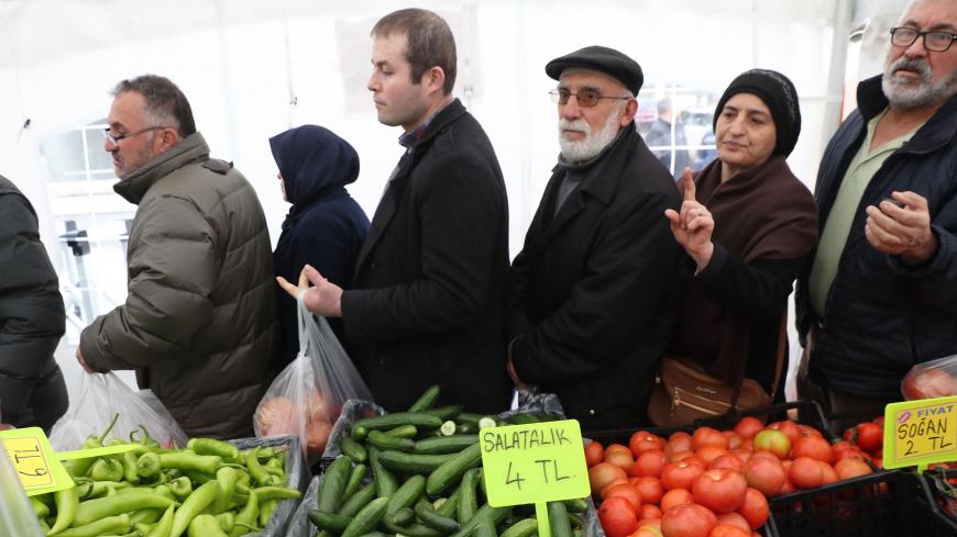 People queue to buy vegetables at a tent set up by the Ankara metropolitan municipality in the Cankaya district of the Turkish capital, on February 13, 2019. - Confronted with persistently high inflation more than a month before local elections, Turkish authorities this week set up stands to sell vegetables at unbeatable prices in a bid to force markets to lower their prices. (Photo by Adem ALTAN / AFP)        (Photo credit should read ADEM ALTAN/AFP/Getty Images)