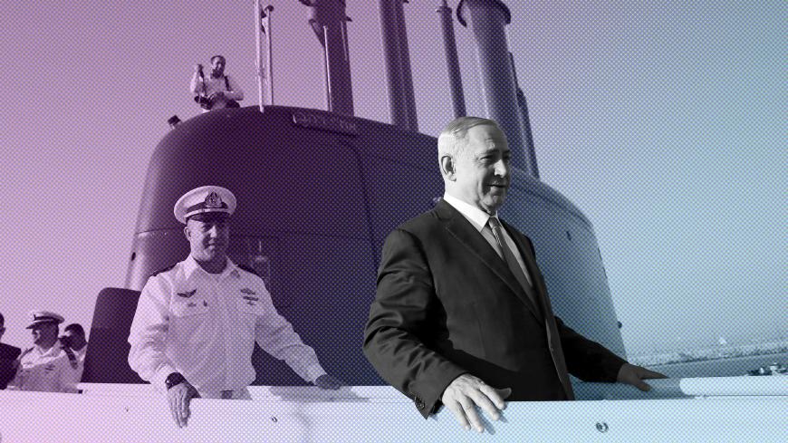 Israeli Prime Minister Benjamin Netanyahu (R) walks on the Rahav, the fifth submarine in the fleet, after it arrived in Haifa port January 12, 2016. The Dolphin-class submarines, widely believed to be capable of firing nuclear missiles, were manufactured in Germany and sold to Israel at deep discounts as part of Berlin's commitment to shoring up the security of the country set in part as a haven for Jews who survived the Holocaust.REUTERS/Baz Ratner - GF20000092319