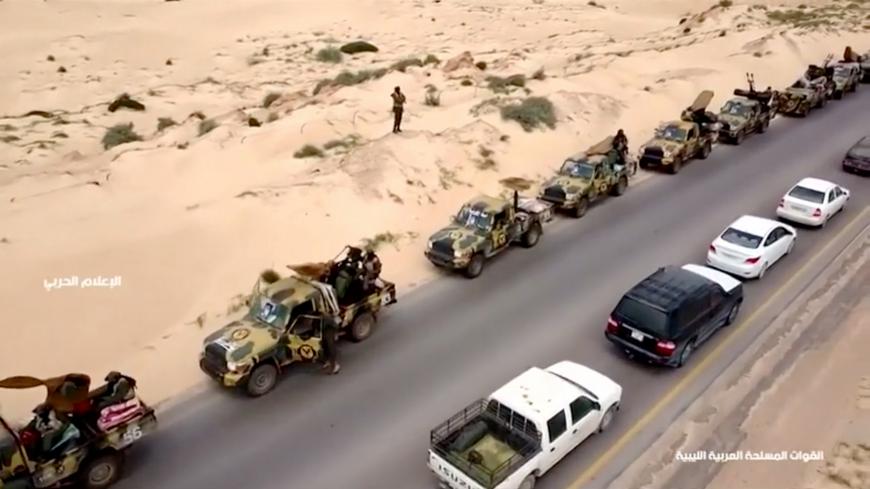 An aerial view shows military vehicles on a road in Libya, April 4, 2019, in this still image taken from video. Reuters TV via REUTERS - RC1720685A20
