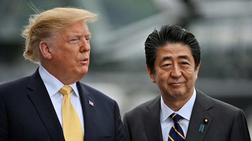U.S. President Donald Trump and Japanese Prime Minister Shinzo Abe onboard the Japan's navy ship Kaga on May 28, 2019 in Yokosuka, Japan. Charly Triballeau/Pool via REUTERS      TPX IMAGES OF THE DAY - RC1356757C20