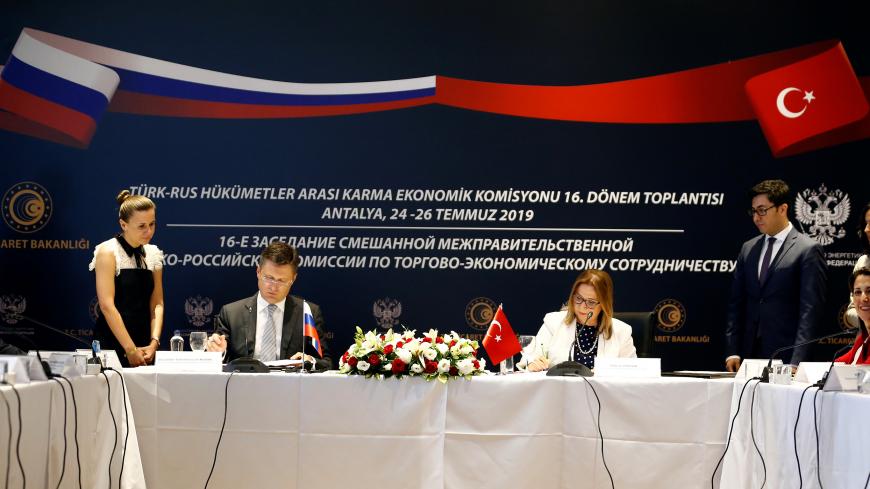 ANTALYA, TURKEY - JULY 26 : Turkish Trade Minister Ruhsar Pekcan (2nd R) and Minister of Energy of Russia, Alexander Novak (2nd L) sign a protocol at the end of the 16th Term meeting of Turkey-Russia Inter-governmental Joint Economic Commission in Antalya, Turkey on July 26, 2019. (Photo by Mustafa Ciftci/Anadolu Agency via Getty Images)