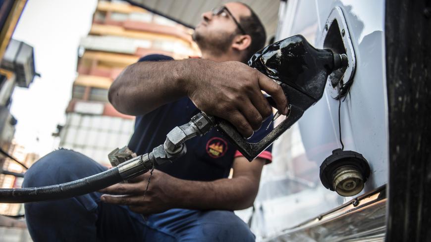 An Egyptian petrol station worker fills up a vehicle's tank in the capital Cairo on June 29, 2017.
Egypt announced a new sharp increase in fuel prices as it slashed government subsidies in a tough IMF-backed reform programme.  / AFP PHOTO / KHALED DESOUKI        (Photo credit should read KHALED DESOUKI/AFP/Getty Images)