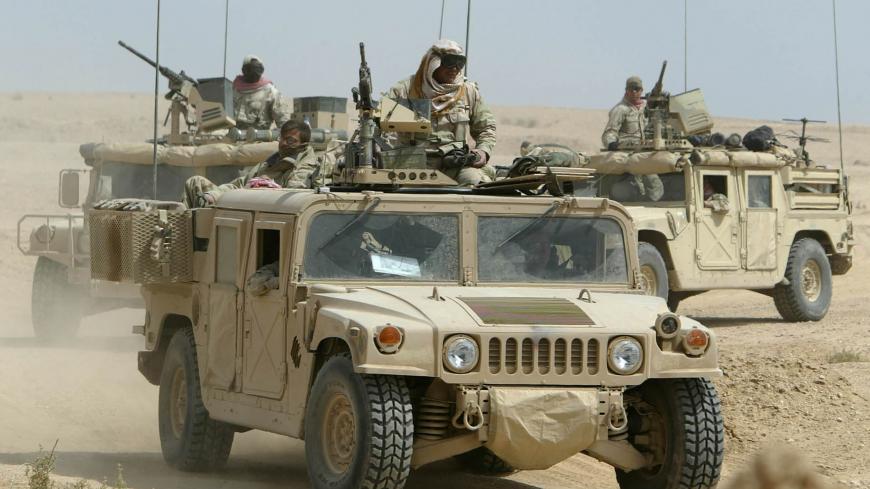 US Army special forces sit on top of their Humvees as they secure
important ground in the south of the city of Najaf in central Iraq,
March 23, 2003. US infantry and engineers secured the ground after
heavy gun fires with Iraqi soldiers during the night. REUTERS/Kai
Pfaffenbach REUTERS

KP/FMS - RP3DRINFAQAA