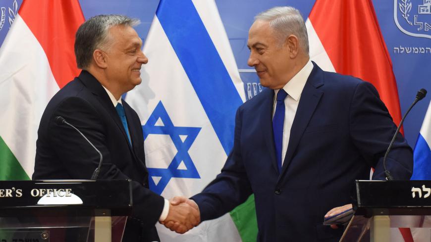 Hungarian Prime Minister Viktor Orban shakes hands with Israeli Prime Minister Benjamin Netanyahu during a joint statment, at the prime minister's office in Jerusalem,  July 19, 2018.  Debbie Hill/Pool via Reuters - RC15A2D3CB00