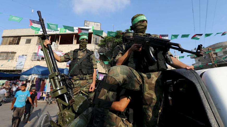 Palestinian members of the al-Qassam Brigades, the armed wing of the Hamas movement, take part in an anti-Israel parade in Rafah, in the southern Gaza Strip July 13, 2015.  REUTERS/Ibraheem Abu Mustafa






 - GF10000158040