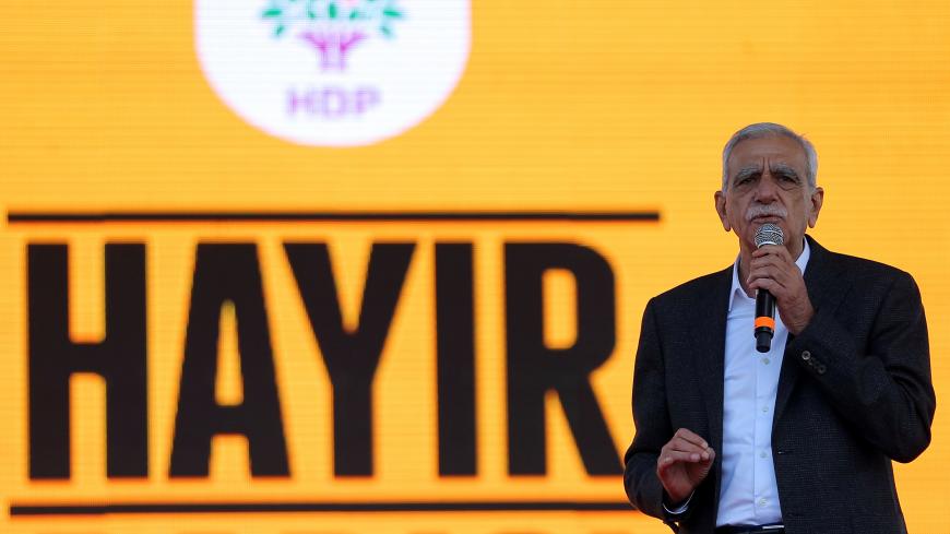 Veteran Kurdish politician Ahmet Turk addresses "Hayir" ("No") supporters during a rally for the upcoming referendum in Istanbul, Turkey, April 8, 2017. REUTERS/Huseyin Aldemir - RC13FE1C8A10