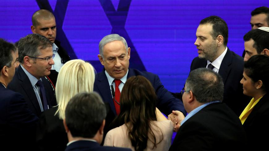 Israeli Prime Minister Benjamin Netanyahu chats with his party members after delivering a statement in Ramat Gan, near Tel Aviv, Israel September 10, 2019. REUTERS/Amir Cohen - RC181A099200