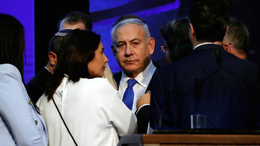 Israeli Prime Minister Benjamin Netanyahu looks on after speaking to supporters at his Likud party headquarters following the announcement of exit polls during Israel's parliamentary election in Tel Aviv, Israel September 18, 2019. REUTERS/Ammar Awad - RC1114A16E10