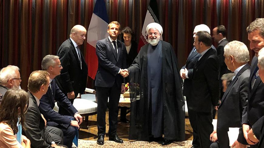 French President Emmanuel Macron shakes hands with Iranian President Hassan Rouhani during their meeting on the sidelines of the United Nations General Assembly in New York, U.S., September 23, 2019. REUTERS/John Irish - RC1C497E08B0