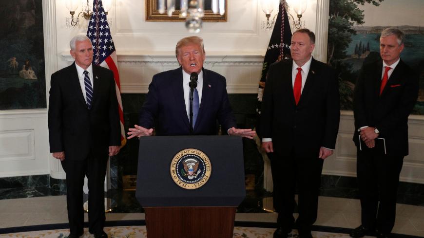 U.S. President Donald Trump delivers a statement on the conflict in Syria as Vice President Mike Pence, Secretary of State Mike Pompeo and White House National Security Advisor Robert O’Brien stand by in the Diplomatic Room of the White House in Washington, U.S., October 23, 2019. REUTERS/Tom Brenner - RC1CA1D434F0