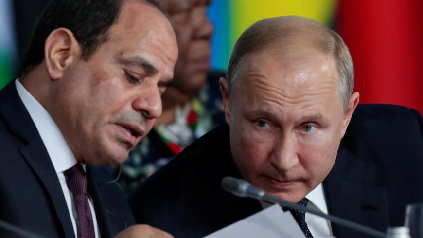 Egypt's President Abdel Fattah el-Sisi speaks with Russia's President Vladimir Putin during the first plenary session as part of the 2019 Russia-Africa Summit at the Sirius Park of Science and Art in Sochi, Russia, October 24, 2019. Sergei Chirikov/Pool via REUTERS - RC1AA9297200