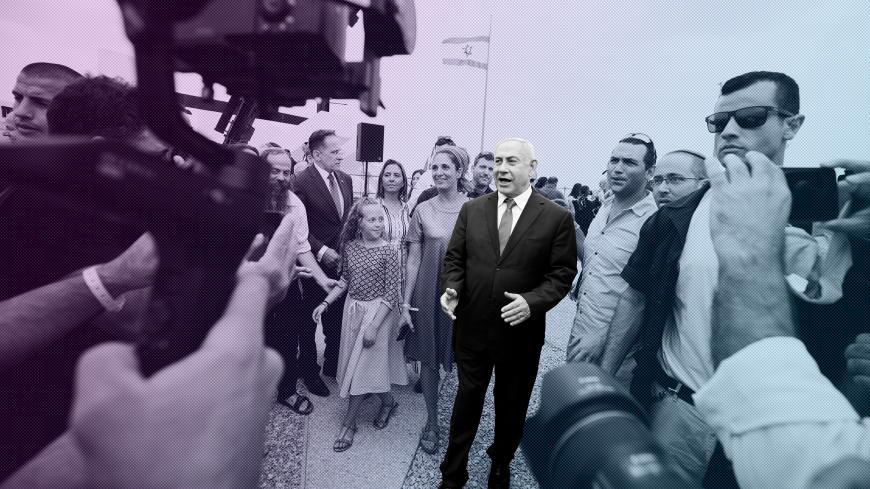 Members of the media work as Israeli Prime Minister Benjamin Netanyahu walks after holding a weekly cabinet meeting in the Jordan Valley, in the Israeli-occupied West Bank September 15, 2019. REUTERS/Amir Cohen - RC1DC97D0610