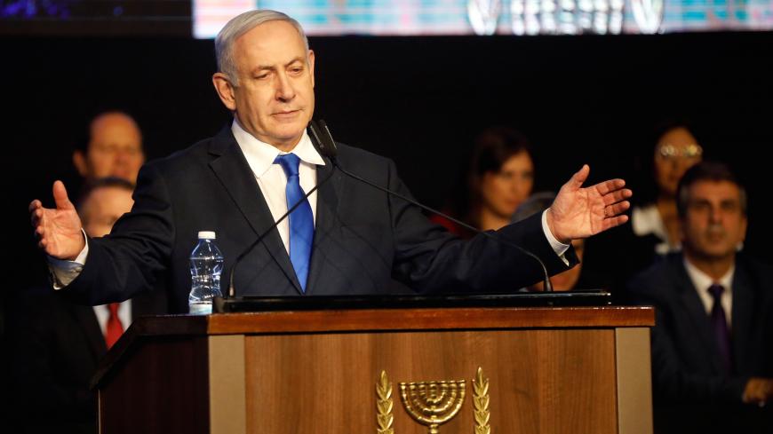 Israeli Prime Minister Benjamin Netanyahu addresses members of his right-wing party bloc at a conference in Tel Aviv, Israel November 17, 2019. REUTERS/Nir Elias - RC26DD9KSAM9