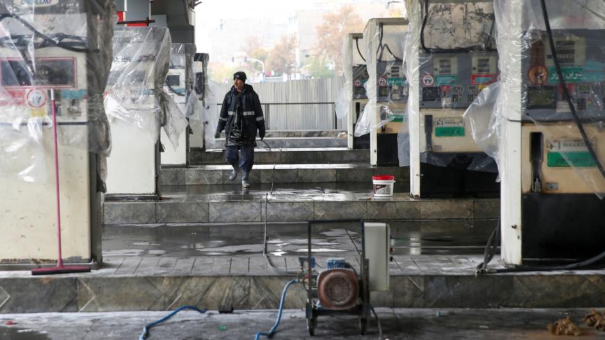 A man walks near the remains of gas pump stands, during protests against increased fuel prices, in Tehran, Iran November 20, 2019. Picture taken November 20, 2019. Nazanin Tabatabaee/WANA (West Asia News Agency) via REUTERS ATTENTION EDITORS - THIS IMAGE HAS BEEN SUPPLIED BY A THIRD PARTY - RC2CGD9I6P5F