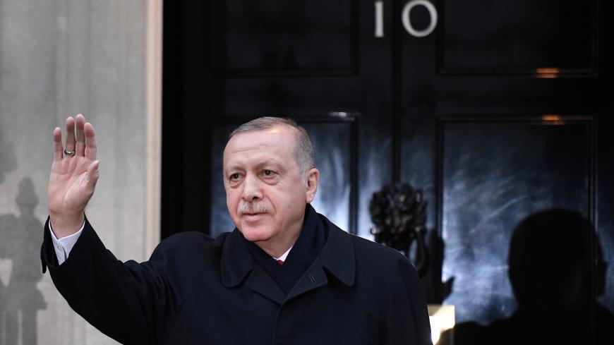 Turkey's President Tayyip Erdogan waves outside 10 Downing Street ahead of the NATO summit in London, Britain December 3, 2019. Daniel Leal-Olivas/Pool via REUTERS - RC2SND9X4TVF