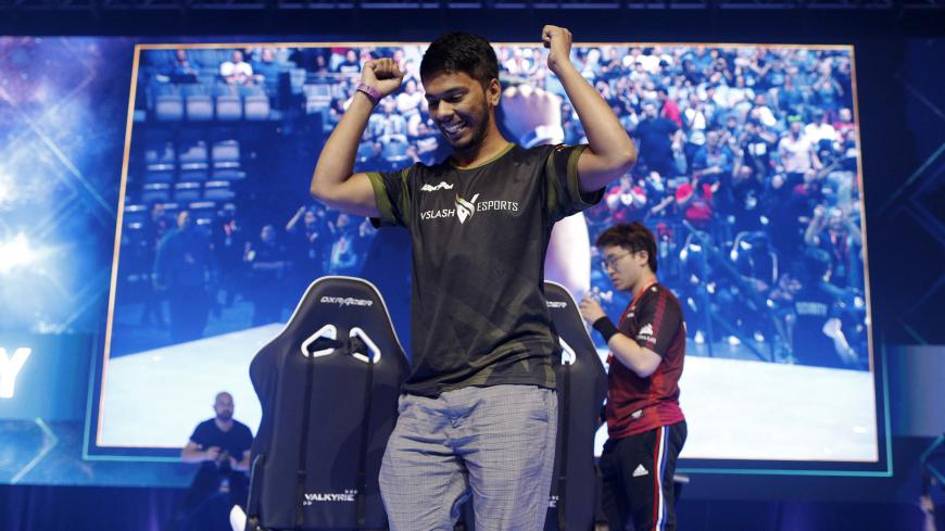 LAS VEGAS, NEVADA - AUGUST 04: Arslan ‘Arslan Ash’ Siddique of vSlash eSports celebrates after winning the Tekken 7 grand championship during day three of the 2019 Evolution Championship Series at Mandalay Bay Resort and Casino on August 04, 2019 in Las Vegas, Nevada. (Photo by Joe Buglewicz/Getty Images)