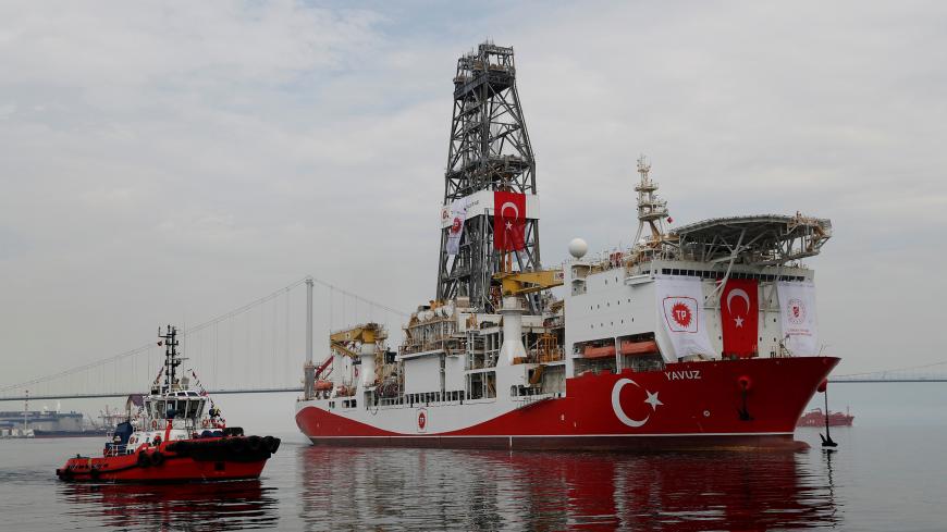 Turkish drilling vessel Yavuz sets sail in Izmit Bay, on its way to the Mediterranean Sea, off the port of Dilovasi, Turkey, June 20, 2019. REUTERS/Murad Sezer - RC1334C23B70
